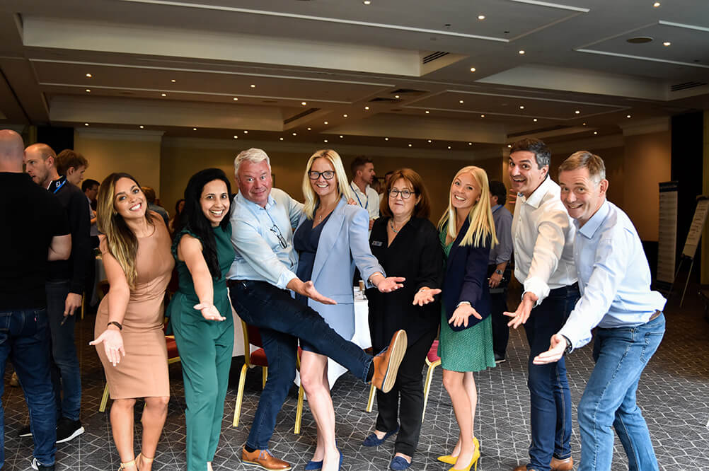 Group of Growth Club attendees posing together at the event